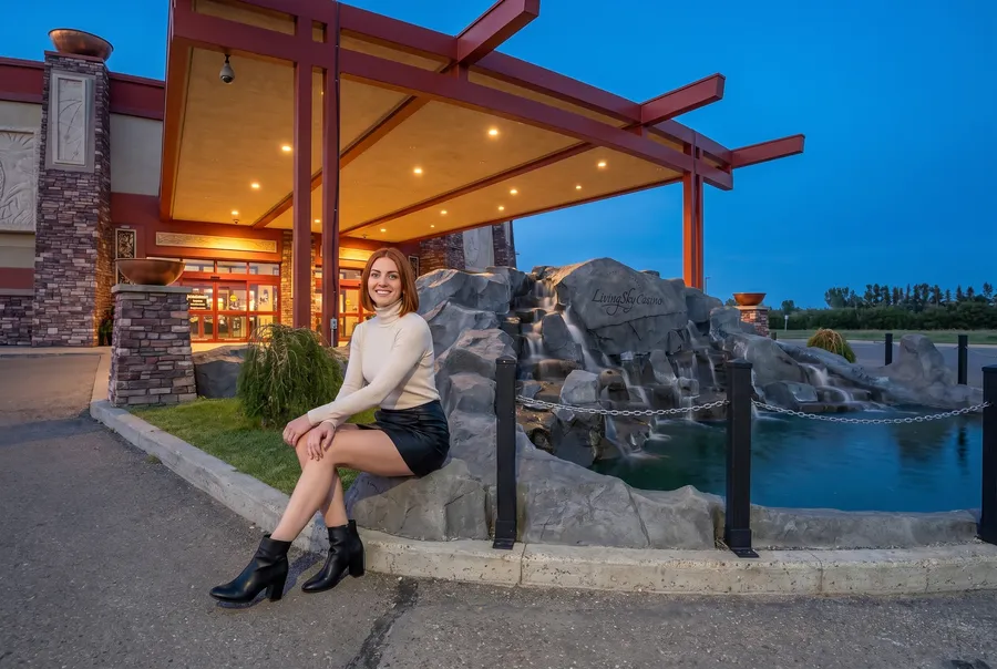 Woman by the waterfall at the Living Sky Casino entrance